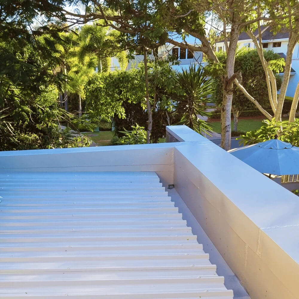 A picture of a restored Box Gutter coated with white Liquid Rubber DIY Tough Coat for waterproofing purposes.